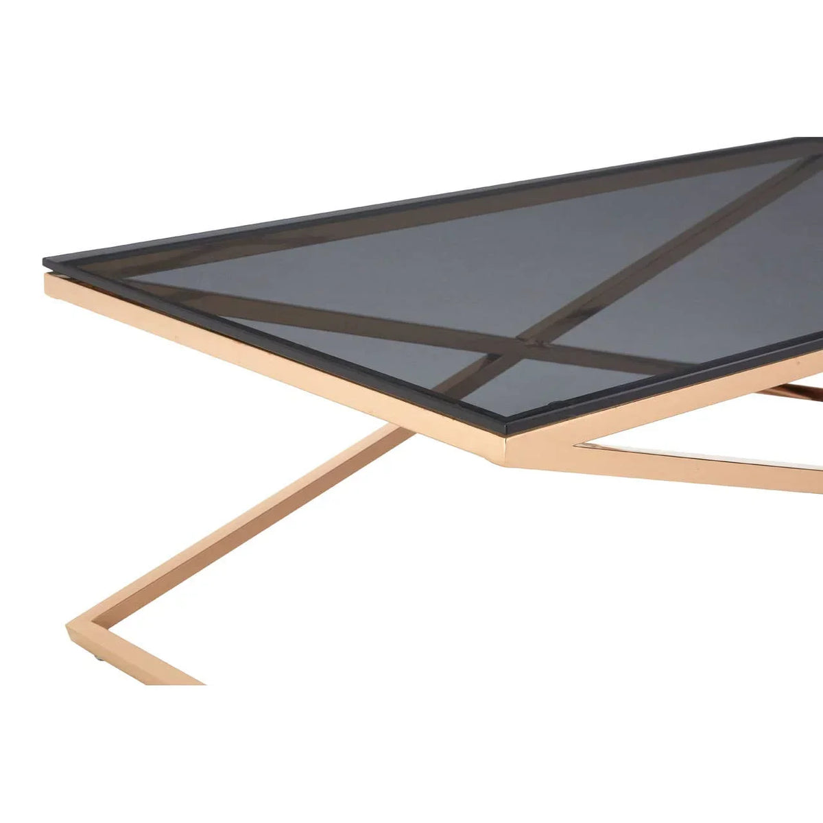 Modern glass coffee table with gold metal frame and geometric base, close view