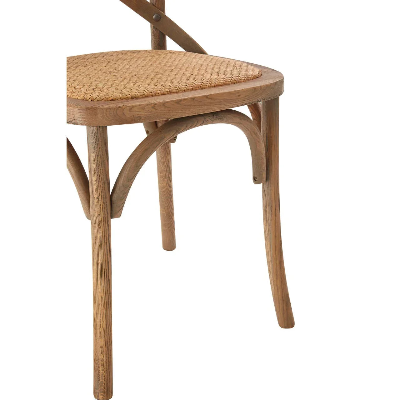 Oak dining chair with woven rattan seat and curved wood frame, close-up view