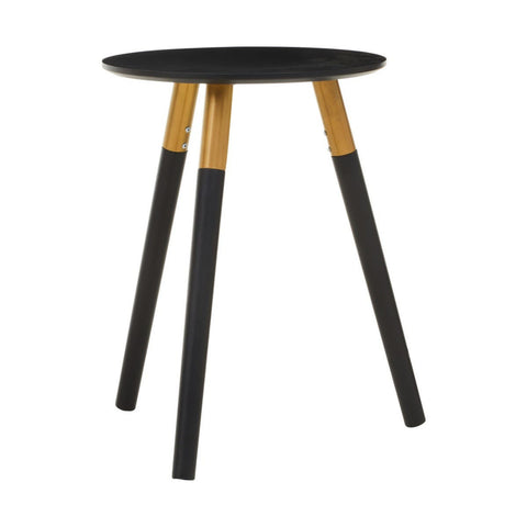 Round black tabletop supported by three wooden legs, two of which are natural wood color and one is black. The design is modern and minimalistic, suitable for various home decor styles