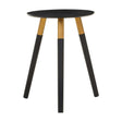 Round side table with a black top and three wooden legs, two of which are black and one is natural wood. The design is modern and minimalist, suitable for various home decor styles