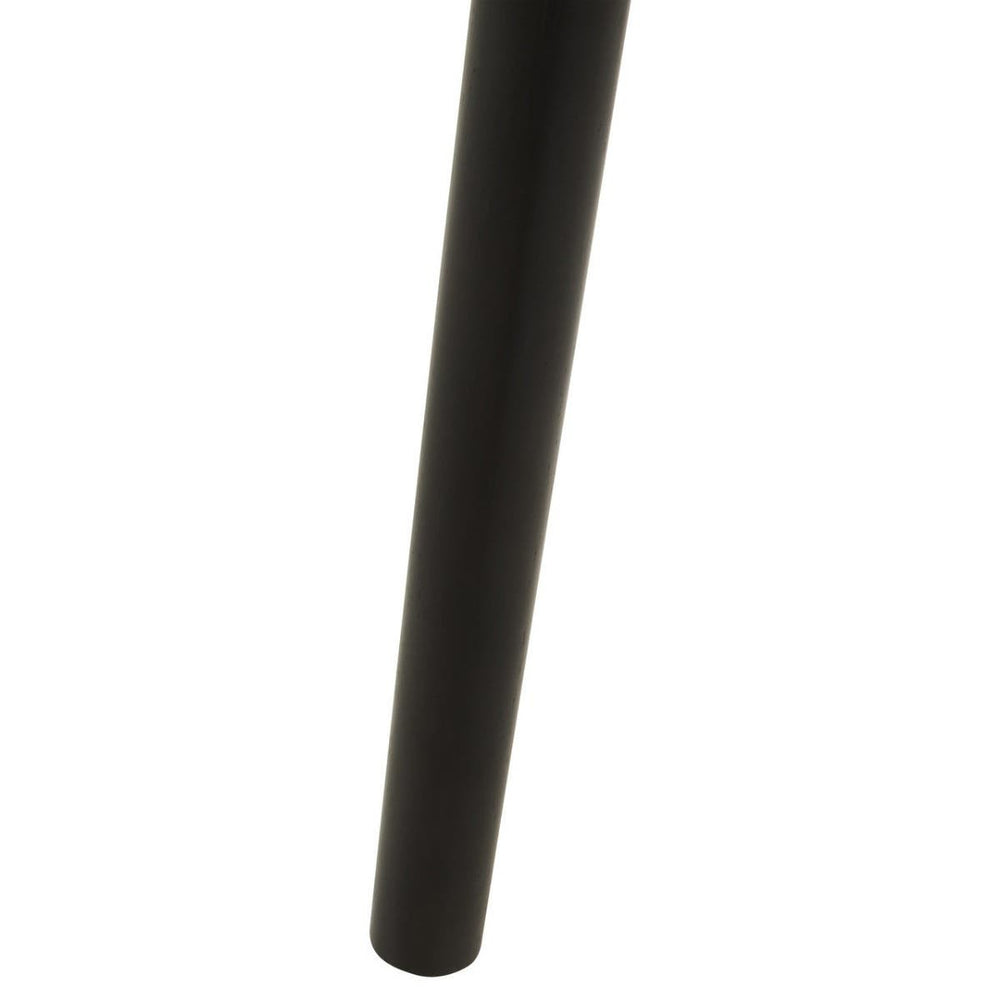 A close-up view of a sleek, dark wooden leg of the Nostra Side Table, showcasing its smooth finish and minimalist design
