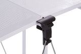Close-up view of the locking mechanism on the Harlow White Rectangular Folding Kitchen Trolley, showcasing a black handle attached to a white frame, designed for easy folding and stability