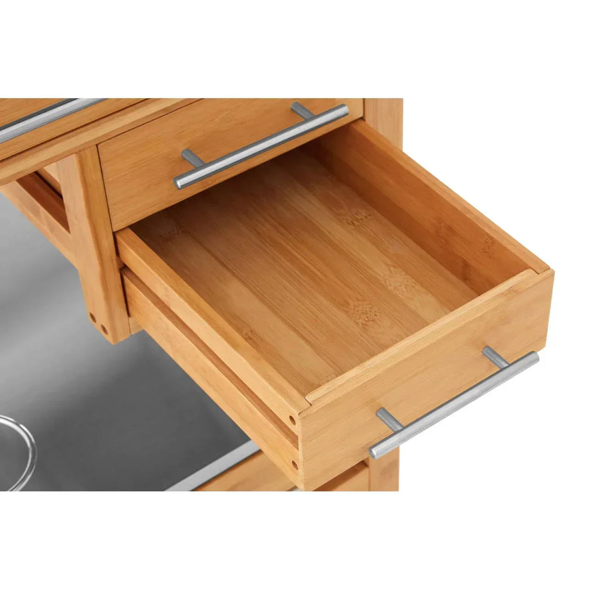 Open wooden kitchen trolley drawer with metal handle on light surface