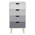 A tall chest of four drawers featuring a gradient design in shades of white, gray, and black, with simple black handles and wooden legs