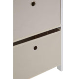 Beige fabric storage drawers with metal grommet handles in white frame, closeup