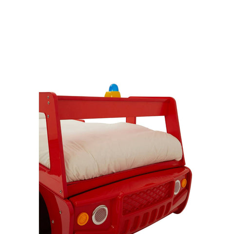 A vibrant red bed designed to resemble a fire engine, featuring a raised headboard with a blue and yellow light on top, and a white mattress visible on the bed frame. The front of the bed includes decorative details like headlights and a grill, enhancing the playful fire truck theme