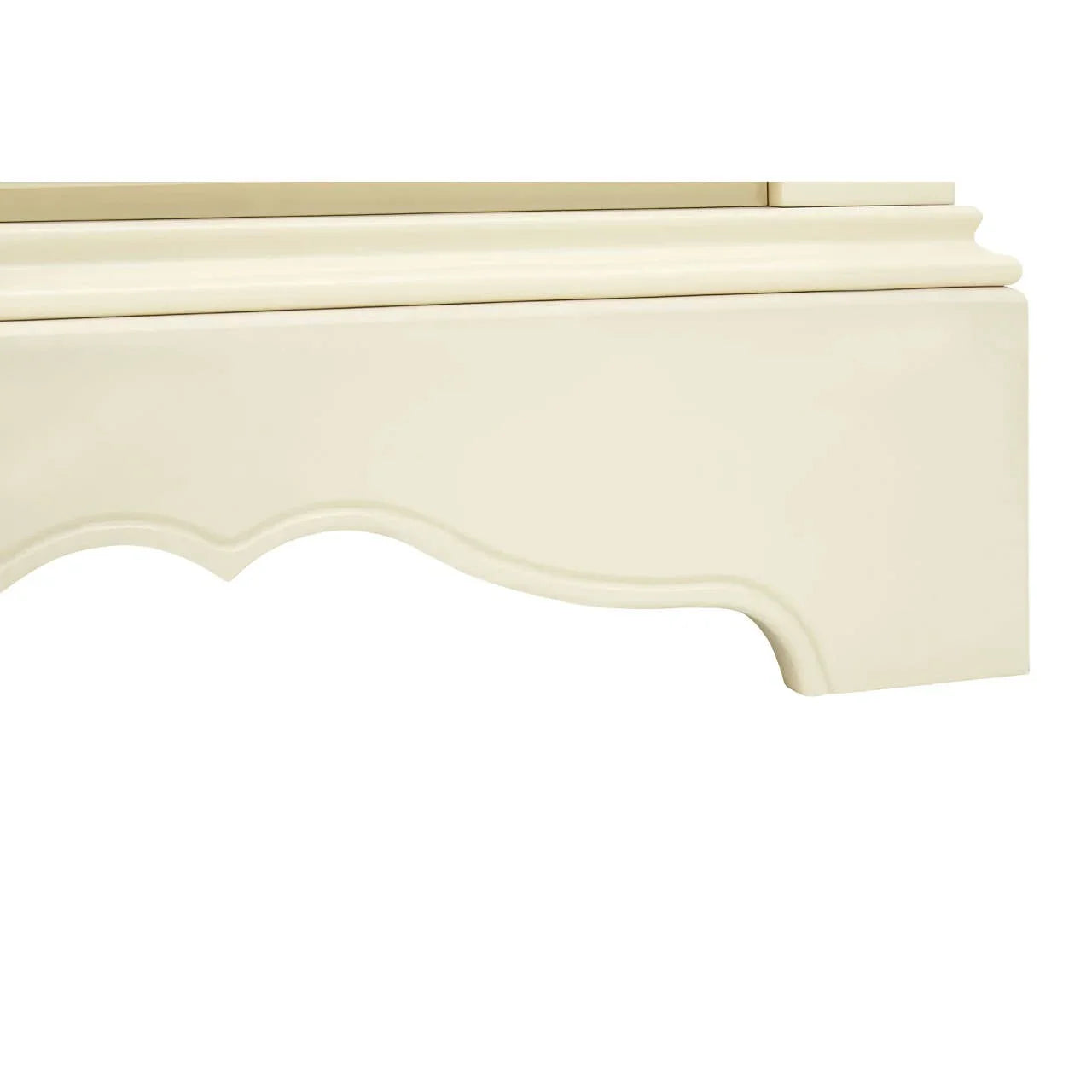 Cream painted wooden furniture leg with decorative curved trim detail