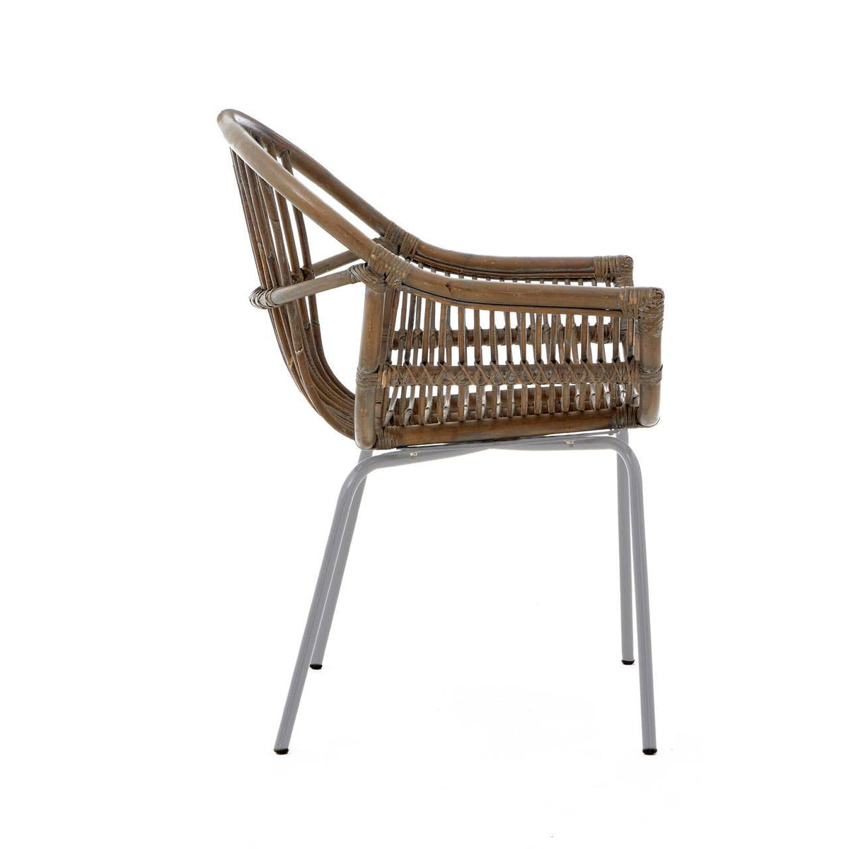 A side view of a Lagom grey wash natural rattan chair featuring a curved backrest and armrests, supported by sleek metal legs. The rattan weave showcases a natural texture, while the grey wash finish adds a modern touch