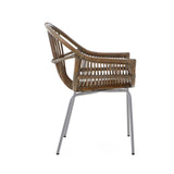 A side view of a Lagom grey wash natural rattan chair featuring a curved backrest and armrests, supported by sleek metal legs. The rattan weave showcases a natural texture, while the grey wash finish adds a modern touch