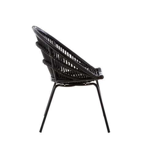 Side view of a black natural rattan chair featuring a woven seat and backrest supported by sleek iron legs. The chair has a modern design with a curved shape, showcasing the intricate rattan pattern