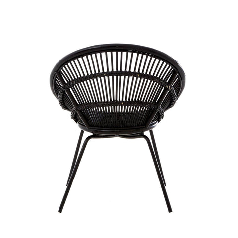 A round black rattan chair featuring a woven design and supported by sleek iron legs, showcasing a modern and minimalist aesthetic suitable for home decor