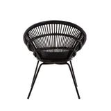 A round black rattan chair featuring a woven design and supported by sleek iron legs, showcasing a modern and minimalist aesthetic suitable for home decor