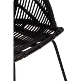 Black natural rattan chair featuring a curved seat design and slender iron legs, showcasing a modern and minimalist aesthetic. The woven rattan pattern is visible, emphasizing its texture and craftsmanship