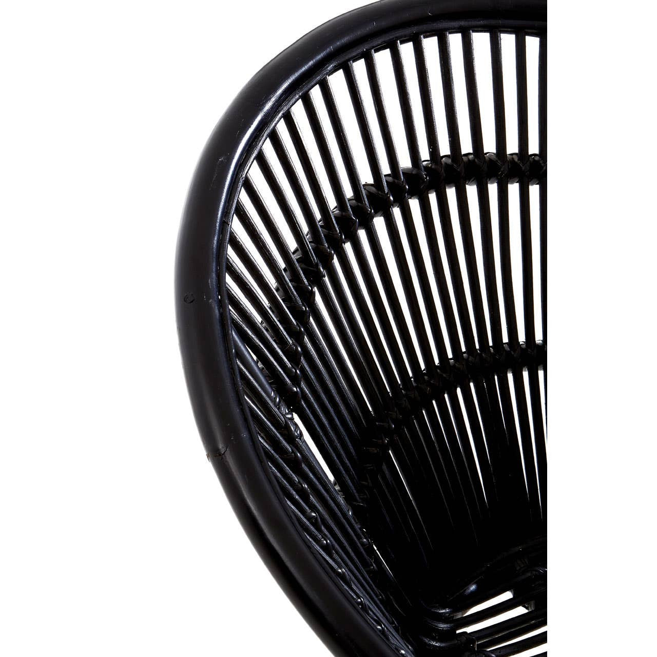 A close-up view of a black natural rattan chair featuring a curved backrest with vertical slats, showcasing the intricate weaving pattern. The chair is supported by sleek iron legs, emphasizing a modern and minimalist design