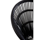 A close-up view of a black natural rattan chair featuring a curved backrest with vertical slats, showcasing the intricate weaving pattern. The chair is supported by sleek iron legs, emphasizing a modern and minimalist design