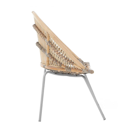 A side view of a Lagom white washed natural rattan chair featuring a curved backrest made of woven rattan and sleek metal legs. The chair showcases a light, airy design with a neutral color palette, suitable for modern home decor