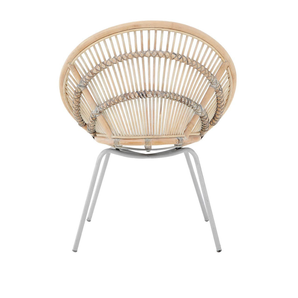 A round chair made of white-washed natural rattan with a woven design, supported by sleek metal legs. The chair features a spacious, open seat that showcases the intricate rattan pattern, creating a light and airy aesthetic suitable for modern home decor