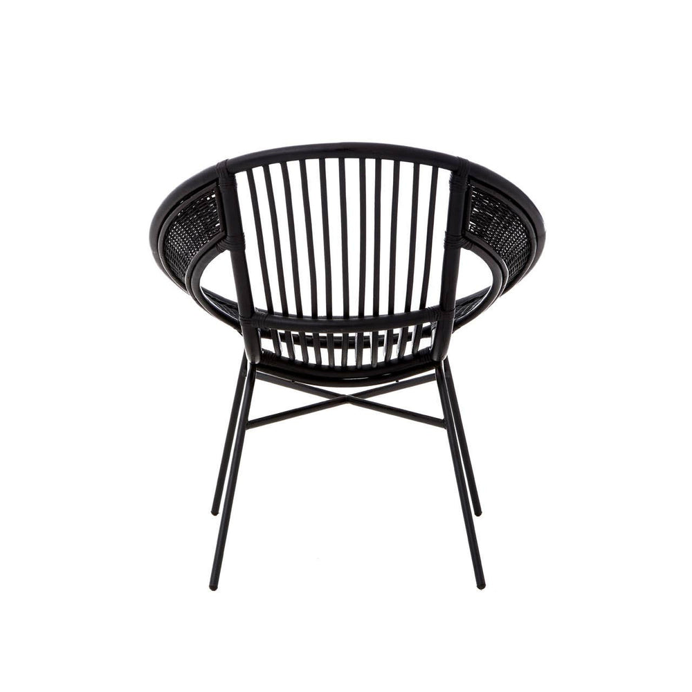A round black chair featuring a natural rattan backrest with vertical slats and a sturdy iron frame, showcasing a minimalist design suitable for modern home decor