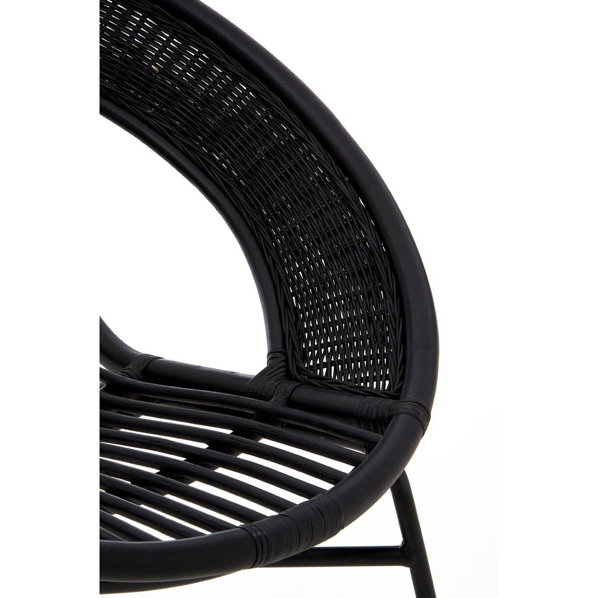A close-up view of a black chair featuring a natural rattan seat and backrest, supported by a sleek black iron frame. The chair has a curved design with visible woven patterns in the rattan, showcasing its modern and stylish aesthetic