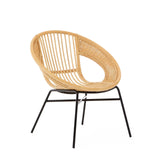 Natural rattan chair with a curved backrest and open design, supported by a sleek black iron frame and legs, showcasing a modern and minimalist aesthetic