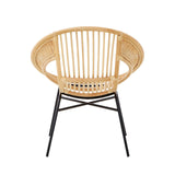 Natural rattan chair with a circular backrest and vertical slats, supported by a black iron frame and legs, showcasing a modern and minimalist design