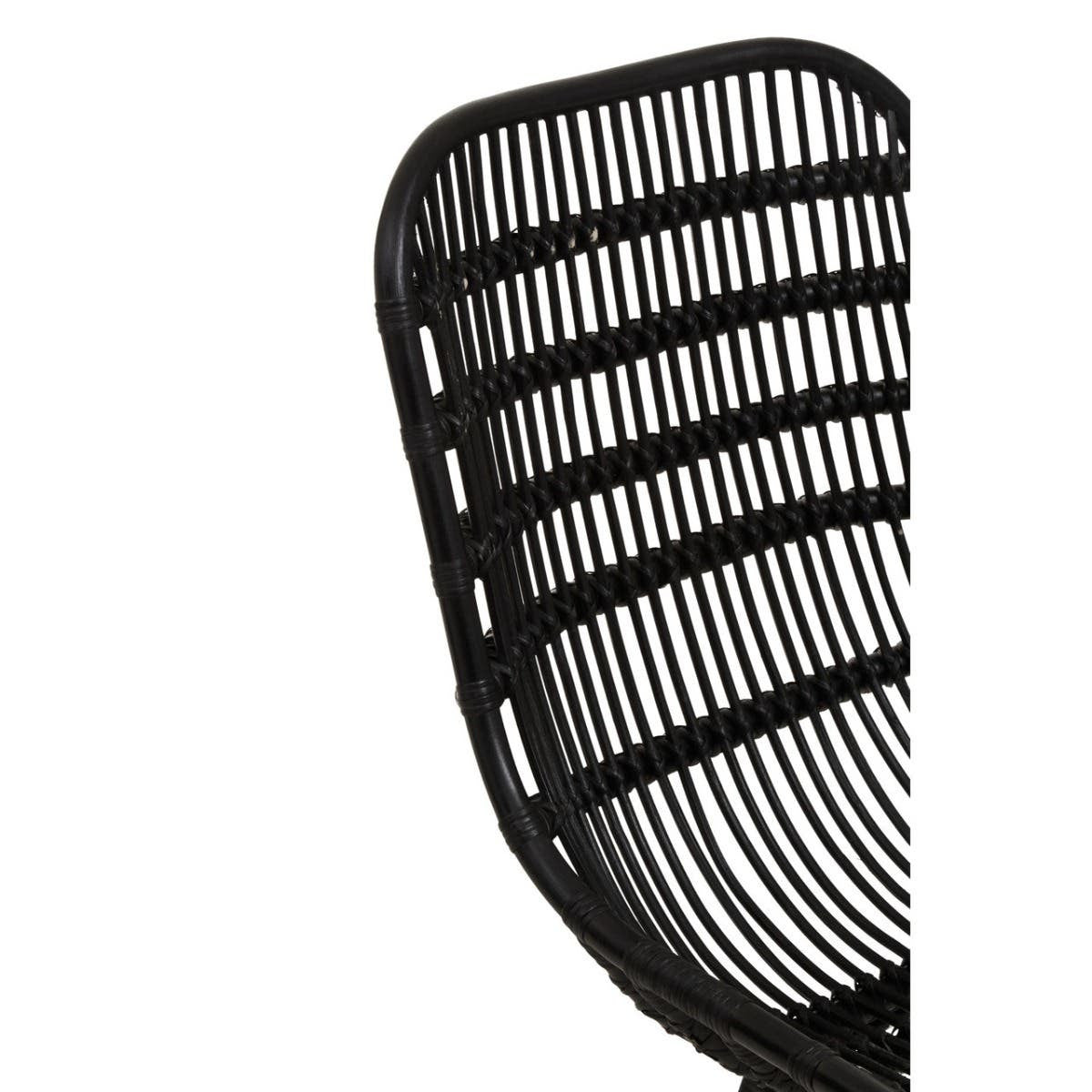 Curved black rattan chair featuring a sleek design with horizontal slats and a natural finish, showcasing the texture and craftsmanship of the rattan material