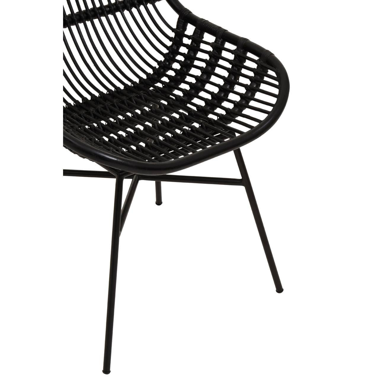 Curved black chair made of natural rattan with a sleek design, featuring a woven seat and slender metal legs
