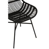 Curved black chair made of natural rattan with a sleek design, featuring a woven seat and slender metal legs