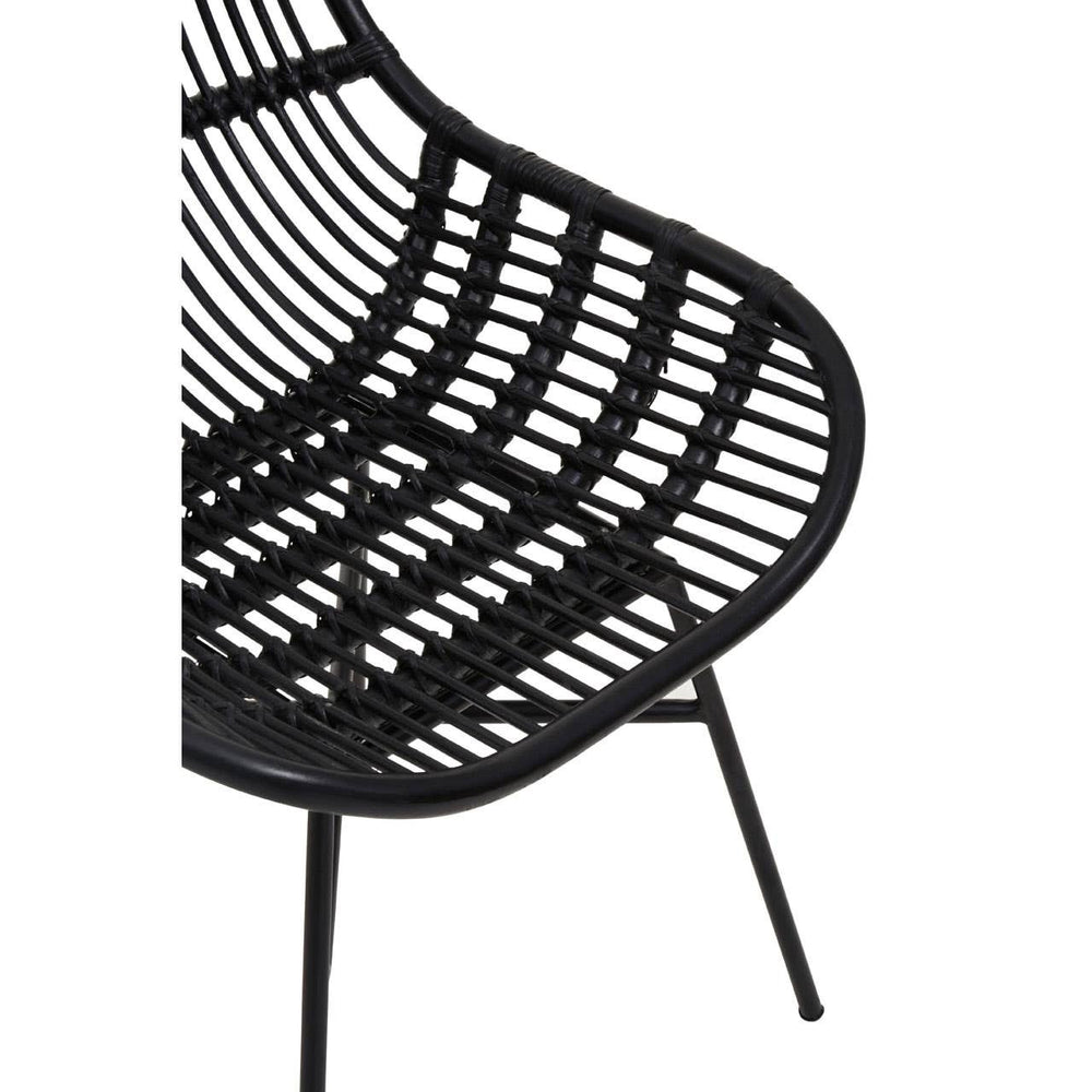 Curved black rattan chair featuring a sleek, open-weave design with a modern aesthetic, supported by slender black metal legs. The chair's shape emphasizes comfort and style, making it suitable for various home decor settings