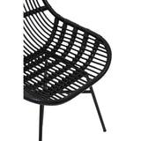 Curved black rattan chair featuring a sleek, open-weave design with a modern aesthetic, supported by slender black metal legs. The chair's shape emphasizes comfort and style, making it suitable for various home decor settings