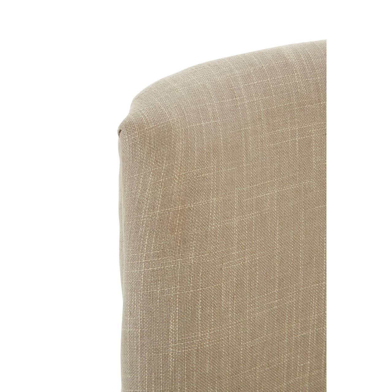 Closeup of beige fabric sofa backrest with subtle textured weave
