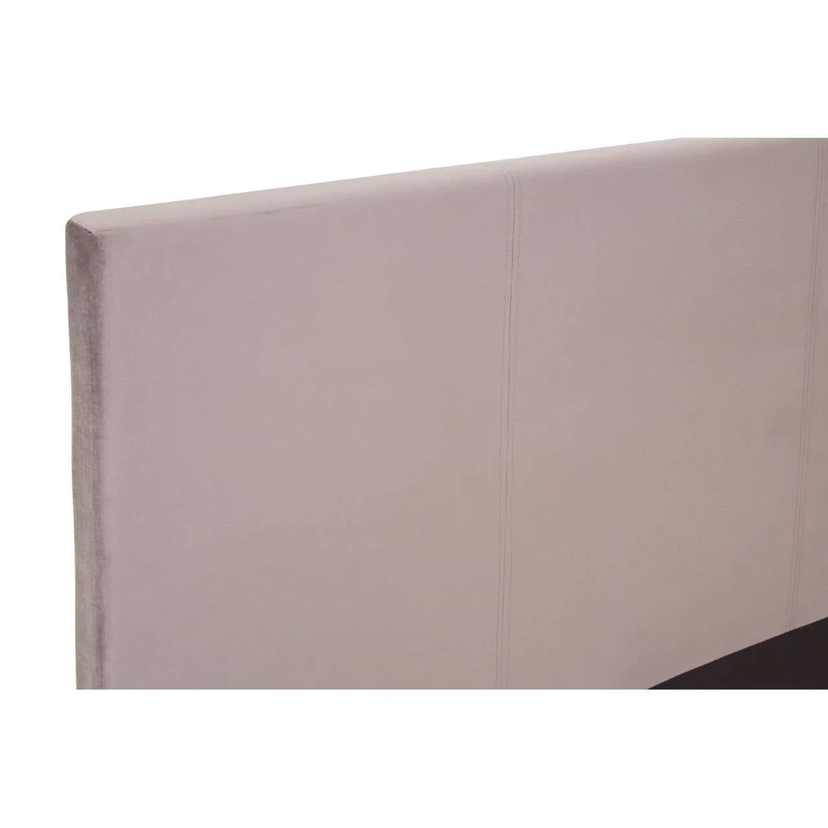 Beige upholstered bed headboard with stitched panel detail, angled view