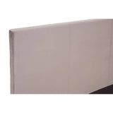 Beige upholstered bed headboard with stitched panel detail, angled view