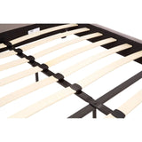Closeup of wooden bed frame slats with black metal support structure