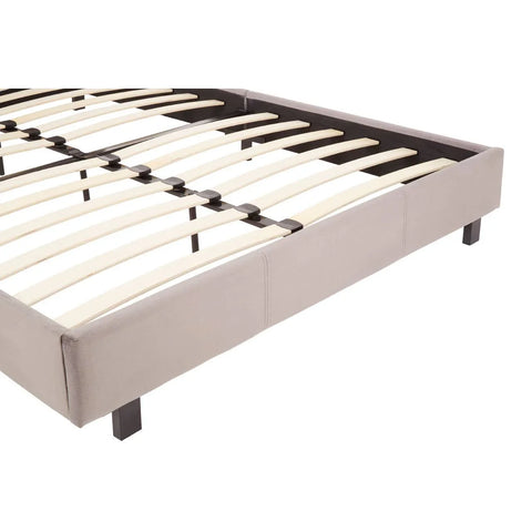 Grey upholstered bed frame with wooden slats and black legs, side angle view