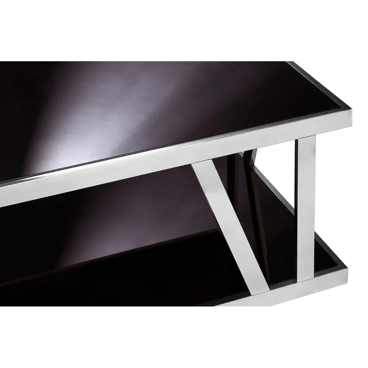 Black glass coffee table with chrome frame and lower shelf, close-up of corner detail