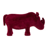 A maroon rhino-shaped stool designed for kids, featuring a plush texture and rounded edges, with short legs and a prominent horn, suitable for playful and imaginative decor