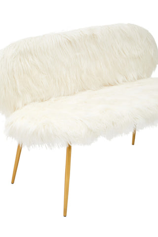 A two-seat sofa featuring a plush white faux fur upholstery with a rounded backrest and soft seating surface, supported by sleek gold finish legs. The design is modern and elegant, ideal for contemporary home decor