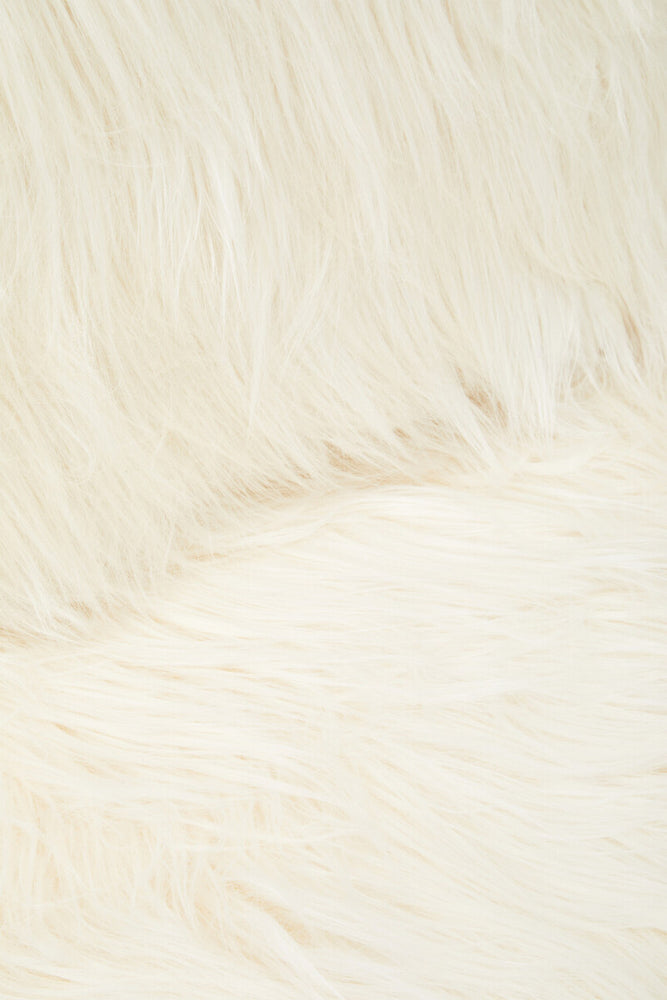 Soft white faux fur upholstery with a plush texture, showcasing a close-up view of the fabric. The fibers appear fluffy and inviting, highlighting the luxurious feel