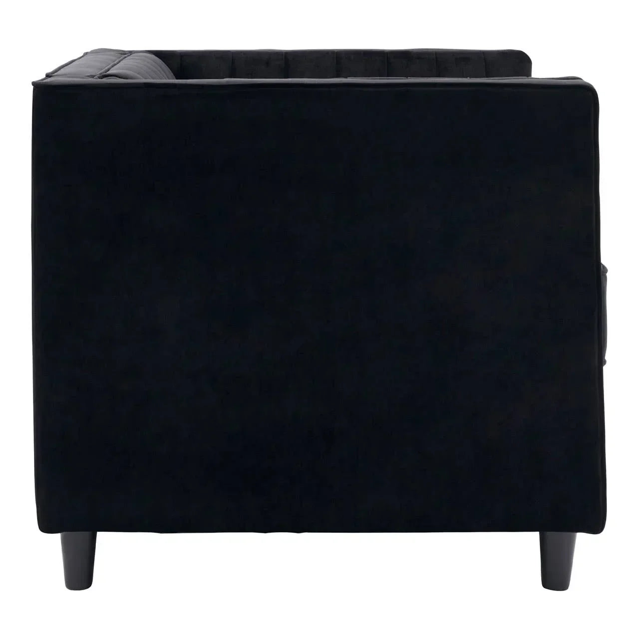 Side view of black velvet sofa armrest with wooden legs