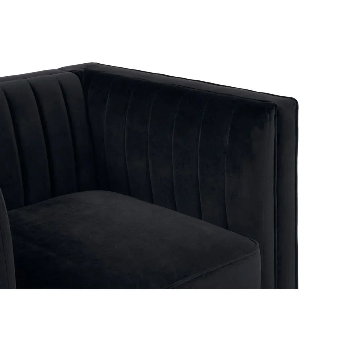 Black velvet sofa corner with vertical stitched panel detail