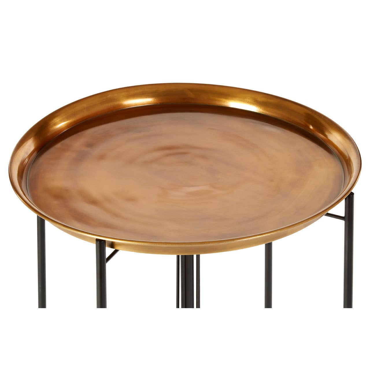 Round side table featuring a large brass tray top with a smooth, polished surface and a raised edge, supported by slender black metal legs. The design combines elegance and modernity, suitable for various home decor styles