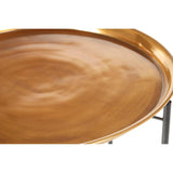 Round brass tabletop with a smooth, shiny surface, featuring a subtle wave pattern, supported by a sleek black metal base with slender legs