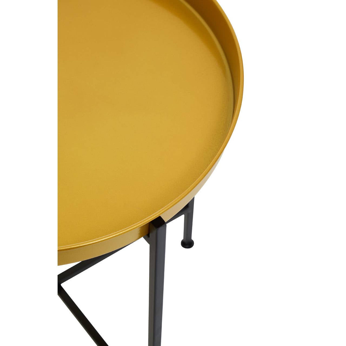 Round side table featuring a brass-colored tray top with a raised edge, supported by a sleek black metal frame with slender legs. The design is modern and minimalist, highlighting the contrast between the warm brass finish and the cool black