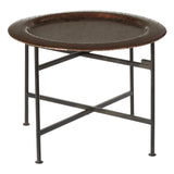 Round side table featuring a copper finish with a crocodile texture on the top surface. The table has a sturdy black metal frame with crossed legs for support. The design is sleek and modern, suitable for various home decor styles