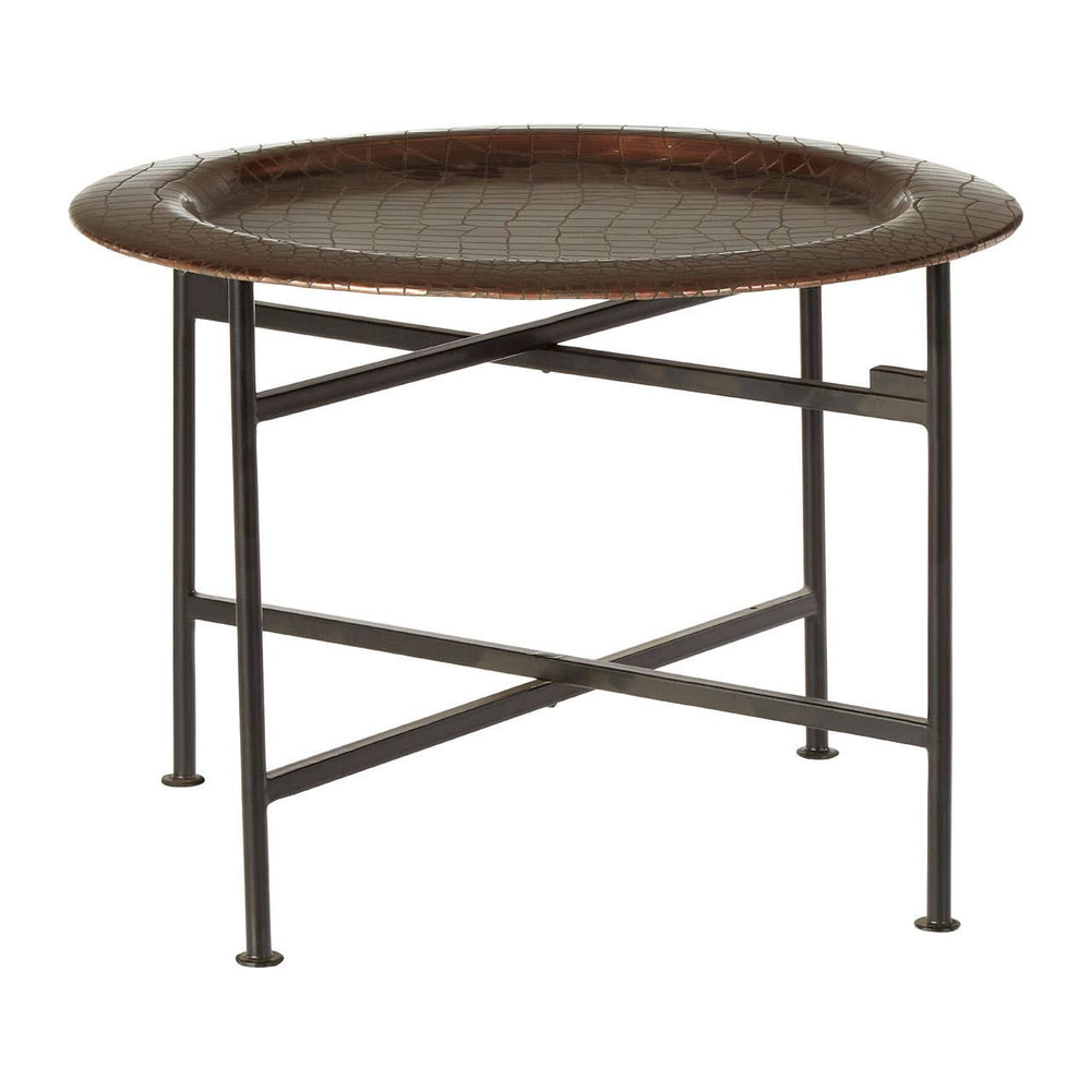 Round side table featuring a copper finish with a crocodile texture on the surface. The table has a sturdy metal frame with a crossbar design for support, and it stands on four slender legs. The overall design is modern and stylish, suitable for various home decor settings
