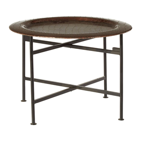 Round side table featuring a copper finish with a crocodile texture on the surface. The table has a sturdy metal frame with a crossbar design for support, and it stands on four slender legs. The overall design is modern and stylish, suitable for various home decor settings