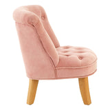 A pink velvet kids chair featuring a tufted seat and backrest, with wooden legs that provide stability and a stylish contrast. The chair has a rounded shape and a cozy design, making it suitable for children's rooms or play areas