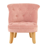 A small, pink velvet chair designed for kids, featuring a curved backrest with button tufting and four wooden legs in a light finish