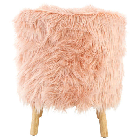 Soft pink faux fur chair with a fluffy texture and wooden legs, designed for kids. The chair has a rounded shape and a cozy appearance, perfect for a child's room or play area